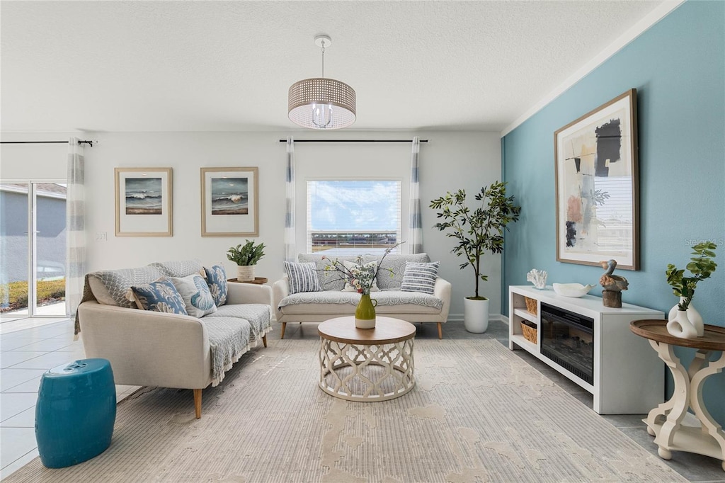 living room featuring tile patterned flooring and a textured ceiling