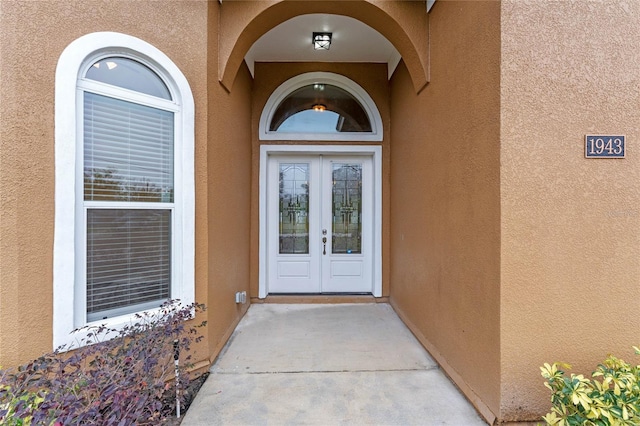 property entrance featuring french doors