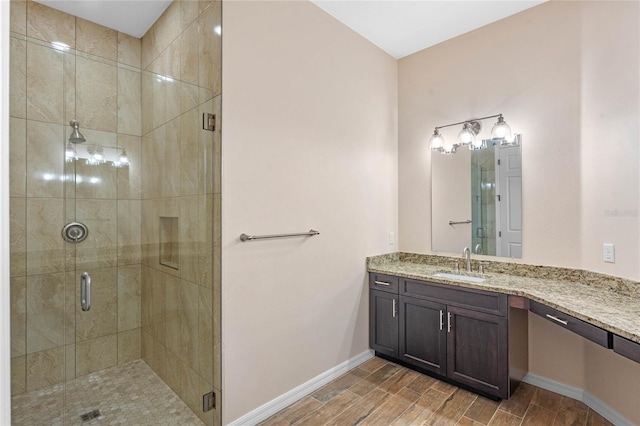 bathroom with vanity and a shower with shower door