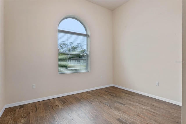 unfurnished room with hardwood / wood-style floors