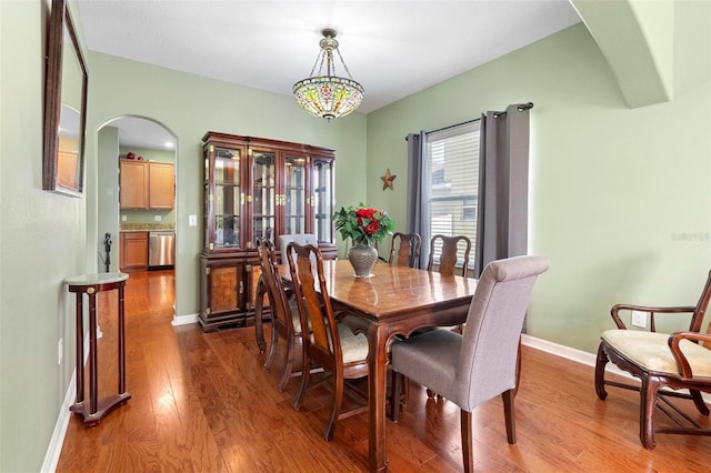 dining space featuring wood-type flooring