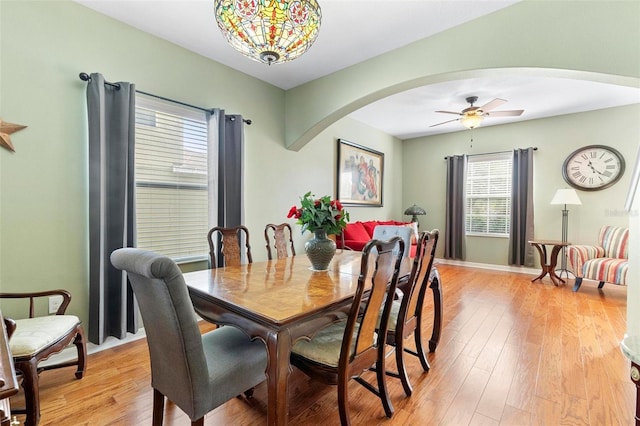 dining area featuring ceiling fan and light wood-type flooring