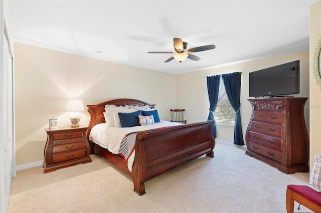 bedroom featuring ceiling fan and light colored carpet