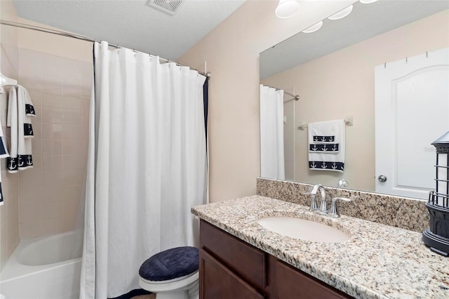 full bathroom featuring a textured ceiling, toilet, vanity, and shower / bath combination with curtain