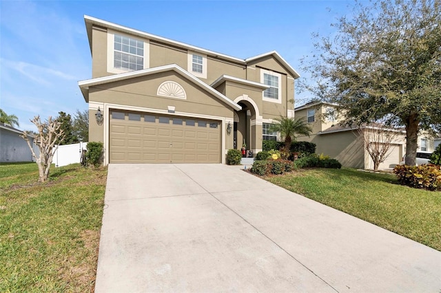 view of front of home featuring a garage and a front lawn