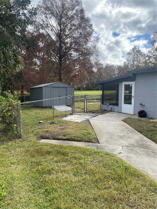 view of yard with fence and a gate