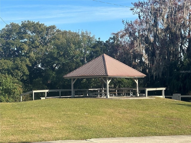 view of home's community with a gazebo and a yard