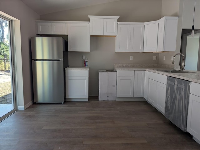 kitchen featuring dark wood-type flooring, sink, white cabinetry, and stainless steel appliances