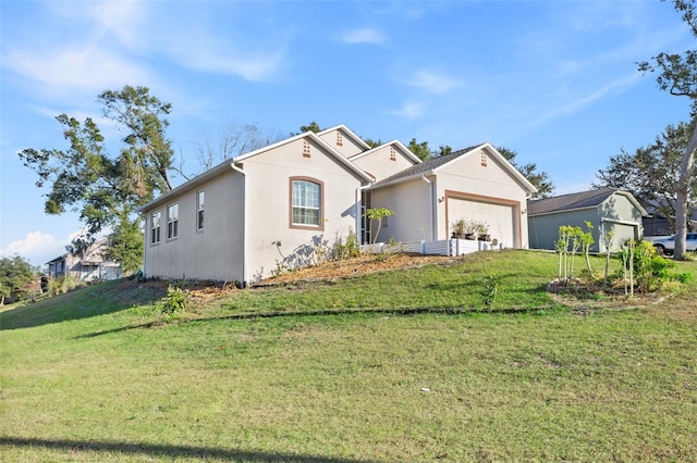 view of front facade with a garage and a front lawn