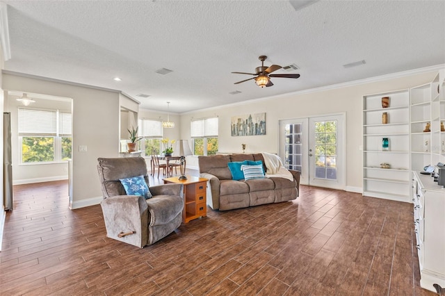 living room with dark wood-type flooring, french doors, crown molding, a textured ceiling, and ceiling fan