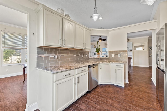 kitchen featuring hanging light fixtures, crown molding, dark wood-type flooring, and dishwasher