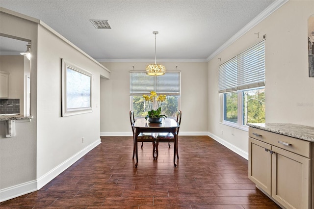 dining room featuring ornamental molding, dark hardwood / wood-style floors, and a textured ceiling