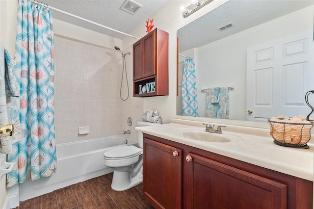 full bathroom with vanity, a textured ceiling, toilet, and shower / bath combo