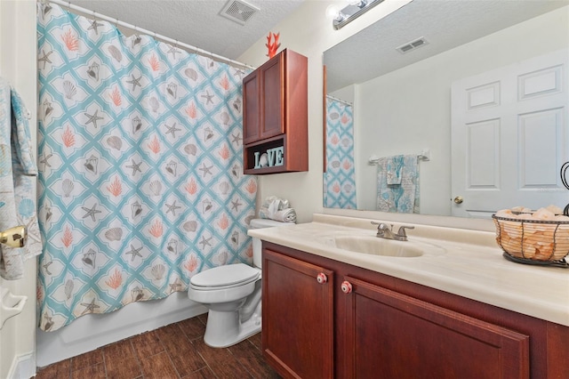 full bathroom featuring toilet, a textured ceiling, vanity, shower / bath combo with shower curtain, and hardwood / wood-style floors