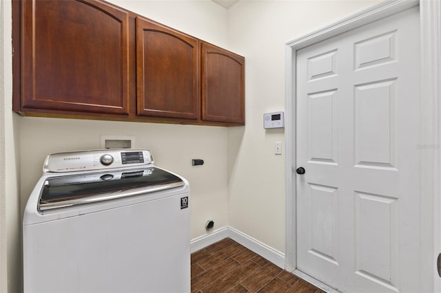 washroom with washer / clothes dryer and cabinets