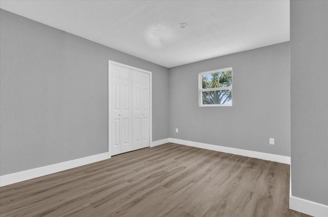 spare room with light hardwood / wood-style floors