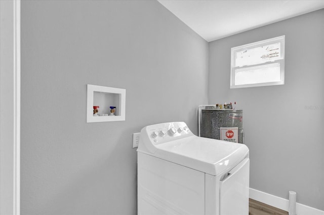 clothes washing area with washer / clothes dryer and hardwood / wood-style flooring