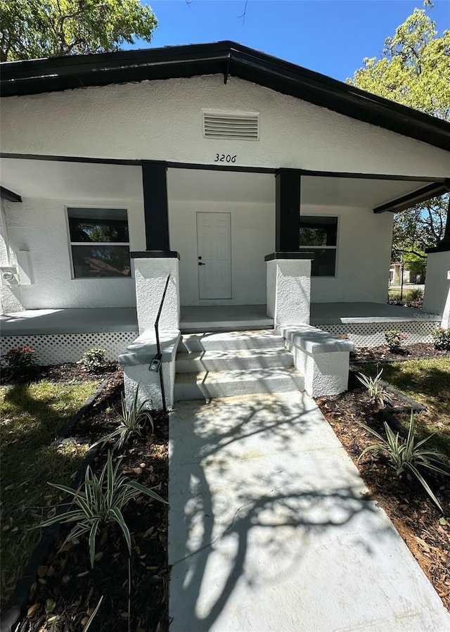 3206 N 29th St, Tampa, FL 33605 - entrance to property with stucco siding and a porch