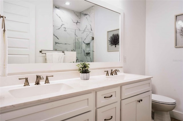 bathroom featuring vanity, toilet, and walk in shower