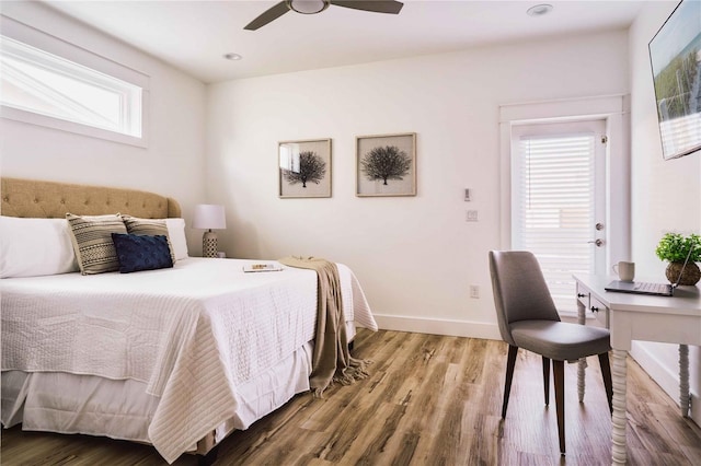 bedroom featuring ceiling fan and hardwood / wood-style floors