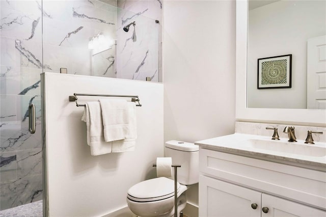 bathroom with vanity, an enclosed shower, and toilet