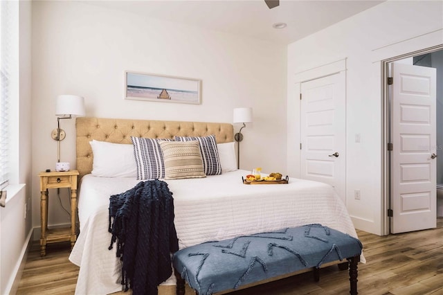 bedroom with hardwood / wood-style floors