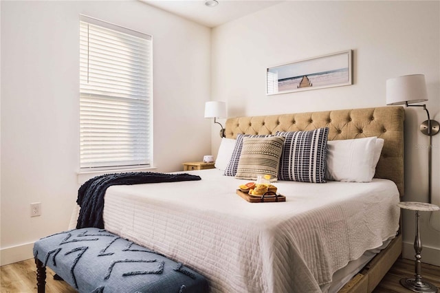 bedroom with wood-type flooring