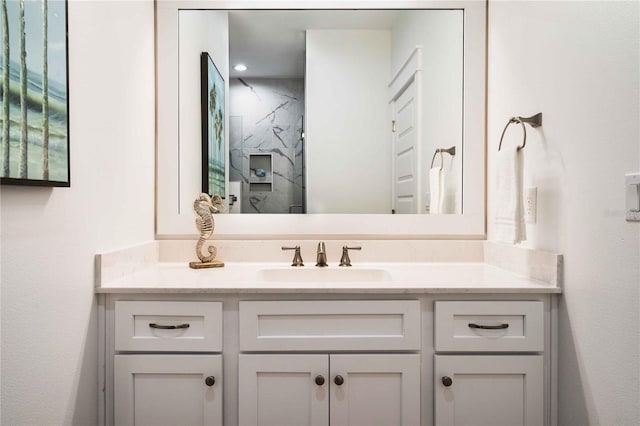 bathroom featuring vanity and a tile shower