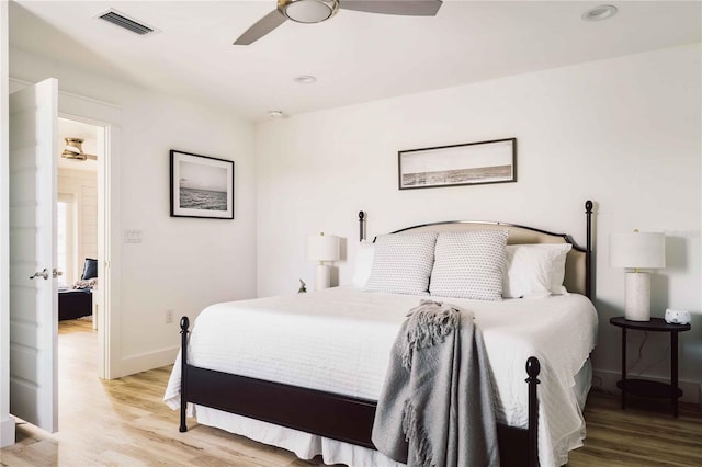 bedroom featuring hardwood / wood-style flooring and ceiling fan