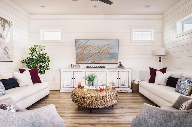 living room featuring hardwood / wood-style flooring and ceiling fan