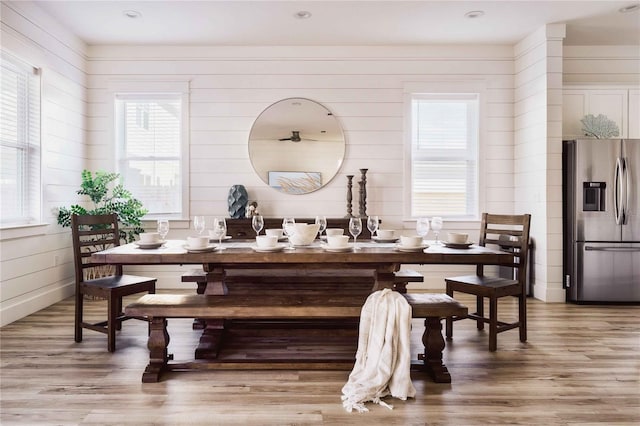 dining space with hardwood / wood-style floors