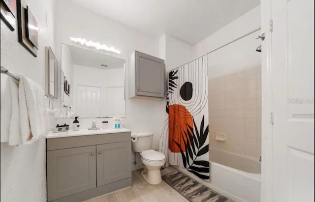 full bathroom with toilet, shower / bath combo, hardwood / wood-style floors, and vanity