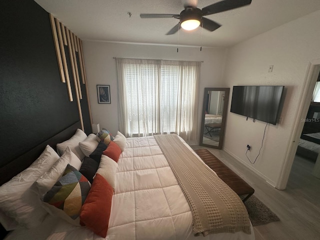 bedroom featuring ceiling fan and light wood-type flooring