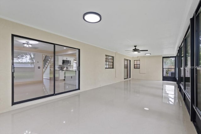 unfurnished room with ceiling fan