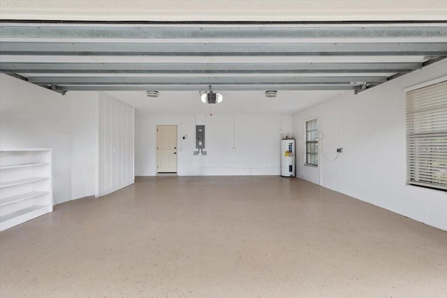 garage featuring a garage door opener, electric panel, and electric water heater