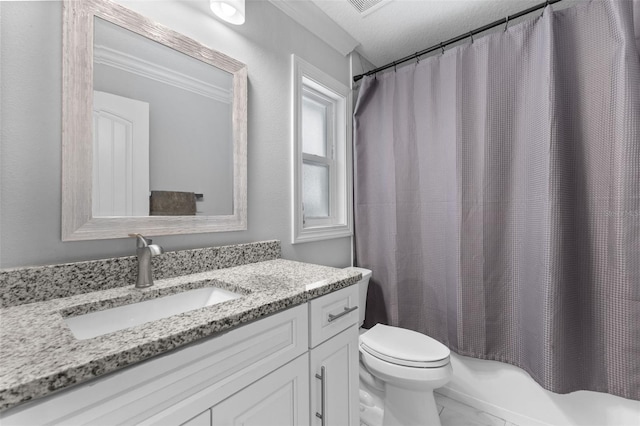 bathroom featuring toilet, vanity, a textured ceiling, and ornamental molding