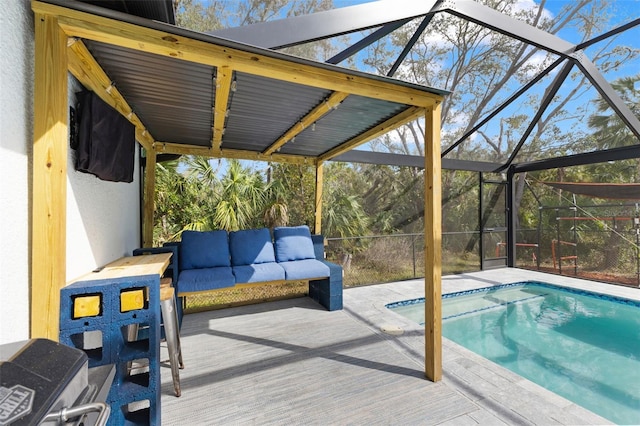 view of pool with a lanai and outdoor lounge area