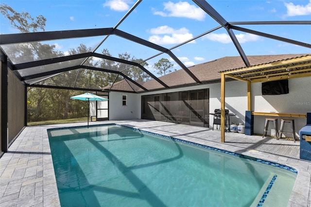 view of pool featuring a lanai and a patio area