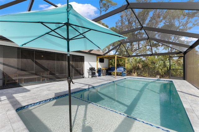 view of pool featuring a lanai, area for grilling, and a patio