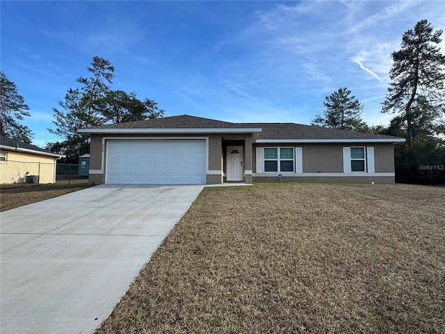 single story home with a front yard and a garage