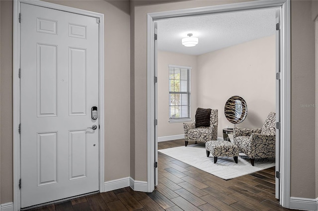 foyer with a textured ceiling