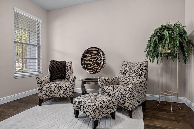 sitting room with dark hardwood / wood-style flooring