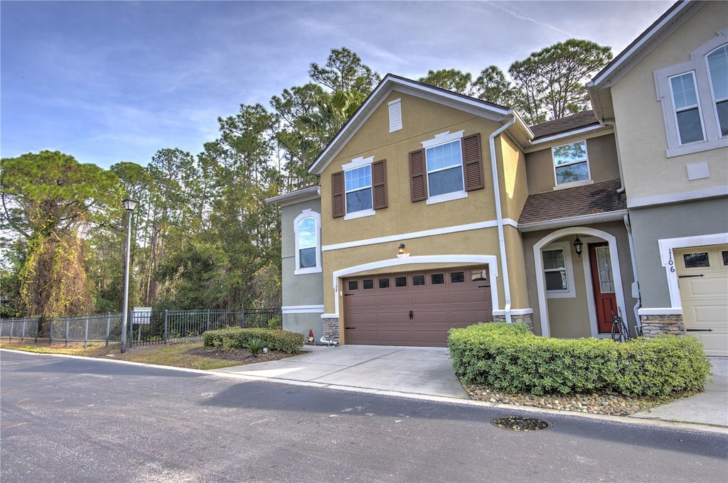 multi unit property featuring a garage