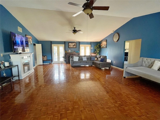 living room featuring high vaulted ceiling, ceiling fan, french doors, and parquet flooring