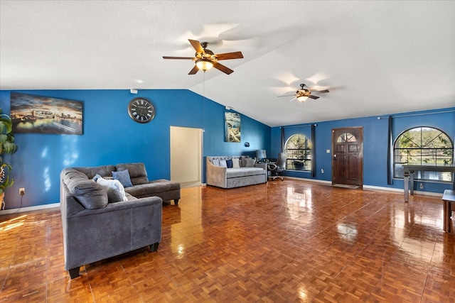 living room featuring vaulted ceiling, a textured ceiling, baseboards, and ceiling fan