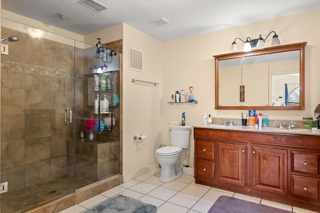 full bath with toilet, double vanity, visible vents, and tile patterned floors