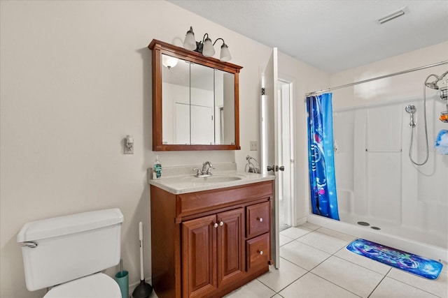 bathroom with visible vents, a shower with shower curtain, toilet, tile patterned floors, and vanity