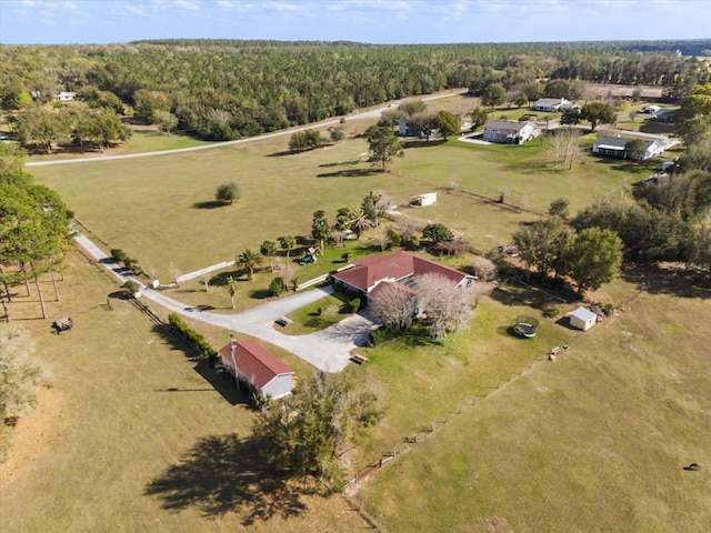 aerial view featuring a rural view and a view of trees