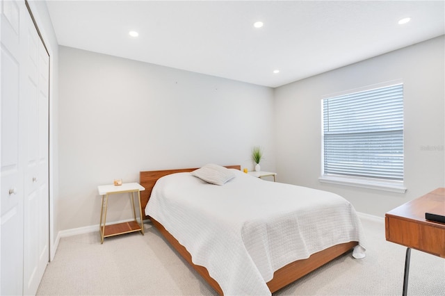 carpeted bedroom featuring a closet