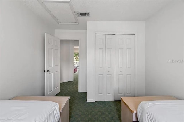 carpeted bedroom with a closet